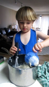 Eli helping me make play dough. He mixed for about 20 minutes using all utensils in his reach. Yep, he needed an apron... especially during this phase where everything becomes an instant "construction site".